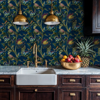 Detailed view of hummingbird wallpaper in navy and green, with a farmhouse sink