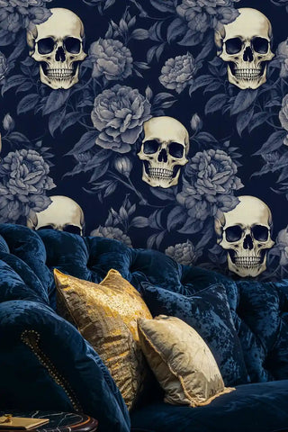 Detailed view of skull floral wallpaper, navy and ivory, shown with a velvet sofa