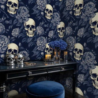 Detailed view of skull floral wallpaper, navy and ivory, with a vanity and candles
