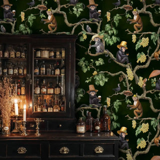 Detailed view of vineyard monkey wallpaper with deep green and gold vines by a bar cabinet