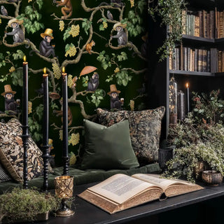 Detailed view of vineyard monkey wallpaper with deep green and gold vines with open book