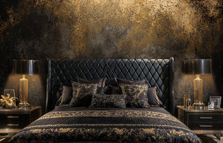 Distressed industrial wallpaper with copper tones in luxury bedroom with quilted leather headboard