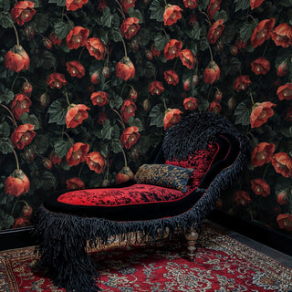 Dramatic floral wallpaper showing coral hellebores in luxurious room with ornate black chaise lounge and Persian rug