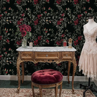 Dramatic floral wallpaper with burgundy blooms shown in elegant dressing room with ornate vanity table