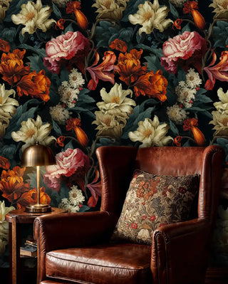 Dramatic floral wallpaper with magnolias and peonies shown in cozy reading corner with leather armchair
