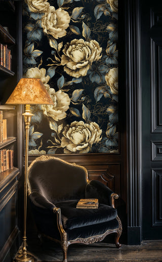 Dramatic peony wallpaper in navy and gold shown in classic study with ornate reading chair