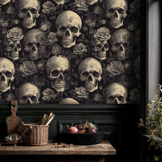 Dramatic skull and rose wallpaper in black kitchen setting with rustic wooden counter and wicker baskets