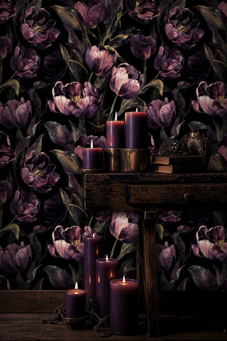 Dramatic tulip wallpaper featuring deep purple florals on black background in elegant room with purple candles