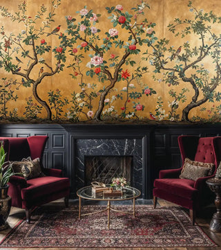 Elegant bird and flower wallpaper in golden tones, showcased in formal sitting room with burgundy velvet chairs