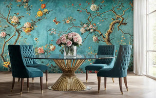 Elegant botanical wallpaper with chinoiserie design on turquoise, featured in modern dining room with glass table