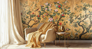 Elegant flowering tree wallpaper in chinoiserie style displayed in cozy sitting area with mustard armchair