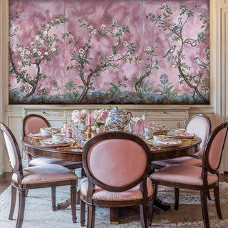 Elegant garden mural with birds among flowering branches, displayed in formal dining room with round table
