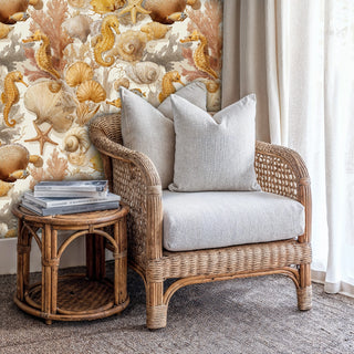 Elegant marine wallpaper with seahorses and shells in reading nook with wicker armchair