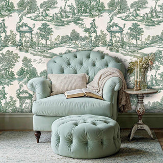 Elegant pastoral wallpaper with toile pattern in green, showcased in reading area with tufted armchair