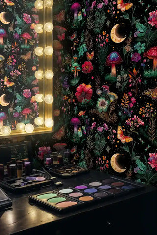 Enchanted botanical wallpaper featuring crescent moons and flowers in vanity area with makeup palettes and mirror