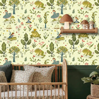 Enchanted forest wallpaper featuring princesses and crowned frogs, displayed in nursery with wooden crib