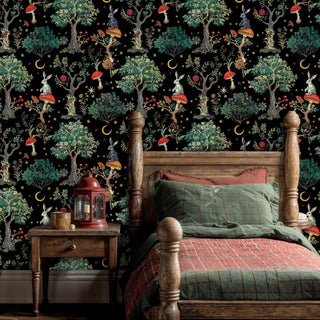 Enchanted forest wallpaper featuring rabbits on red mushrooms and golden trees in a cozy bedroom with wooden bed frame