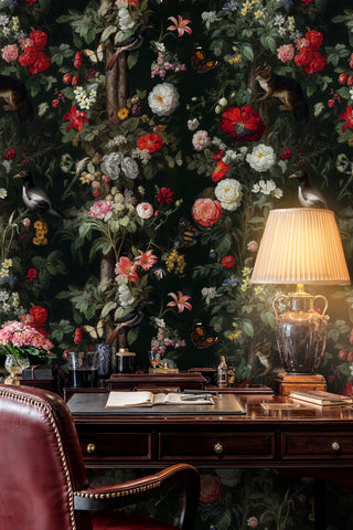 Enchanted garden wallpaper with roses and butterflies on dark ground, in an office with leather chair and urn lamp