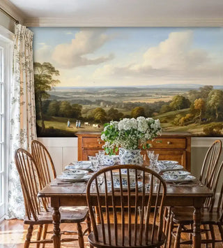 English countryside wall mural featuring rolling hills, grazing cattle, and pastoral landscape in a farmhouse dining room