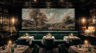 English landscape wall mural with trees and river in upscale restaurant with green banquettes