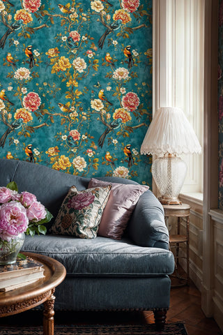 Exotic birds wallpaper with colorful songbirds and blooming flowers on teal background in elegant living room