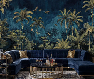 Exotic botanical wall mural with golden palms and birds on deep blue, shown in sophisticated living room