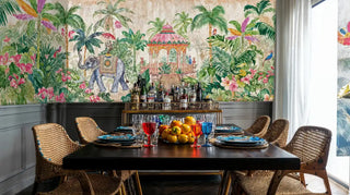 Exotic elephant wall mural with ornate pavilion in dining room with brass bar cart