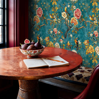 Exotic floral wallpaper with birds and peonies in teal and coral tones, displayed in dining room with round table
