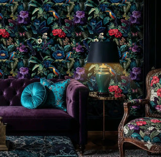 Exotic paradise wallpaper with kingfishers and tropical blooms in rich living room with purple velvet sofa