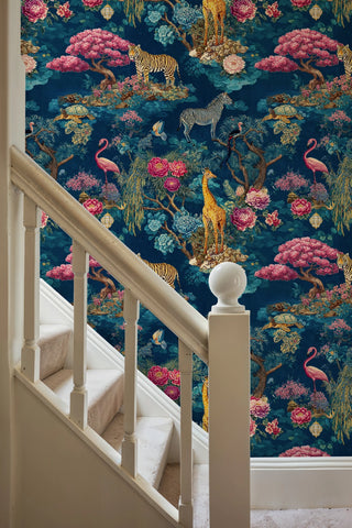 Exotic safari mural featuring wildlife and floral motifs in rich jewel tones, displayed in elegant hallway with white wooden staircase