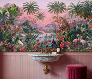 Exotic tropical wallpaper showing pink sunset and tropical birds, installed in elegant powder room with marble sink