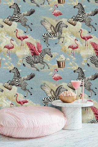 fantastical animal wallpaper with winged zebras and flamingos, displayed in lounge with pink floor cushion