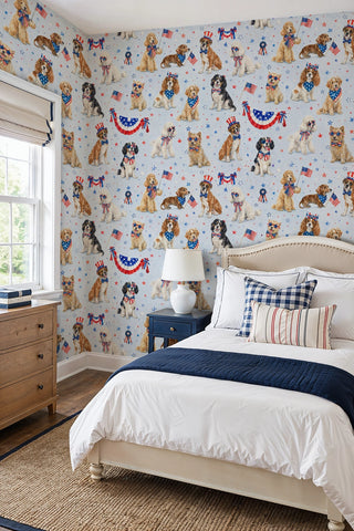 Festive dog wallpaper with spaniels and buntings on light blue, in a bright bedroom with linen headboard and striped pillows