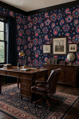 Fireworks wallpaper with red blue and white starbursts on navy, shown in a classic home office with globe