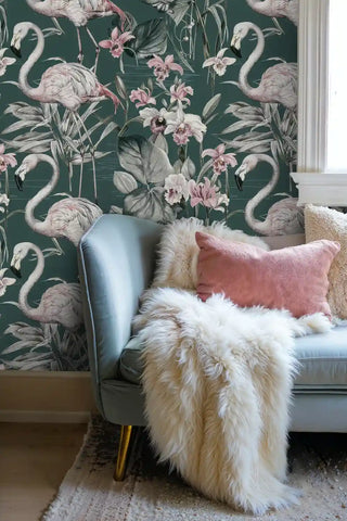 Flamingo botanical wallpaper featuring graceful birds among lush foliage in modern bedroom with blue leather chair