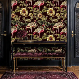 Flamingo paradise wallpaper with rich burgundy background, displayed in sophisticated entryway with gold accent bench
