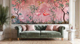 Flamingo wallpaper featuring exotic birds and flowering trees, displayed in elegant living room with green chesterfield sofa