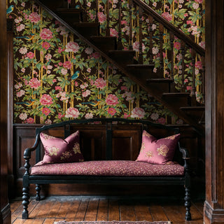 Floral bird wallpaper in chinoiserie style with bamboo motifs, shown in an entryway with wooden staircase