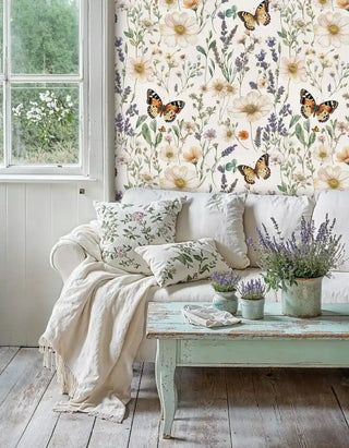 Floral butterfly wallpaper featuring soft peach cosmos and purple lavender, in cozy reading nook with mint green coffee table