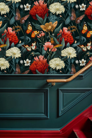 Floral butterfly wallpaper in teal and coral creating dramatic stairway accent with red carpet runner