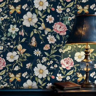 Floral wallpaper featuring white cosmos and coral peonies, displayed in study room with vintage brass lamp
