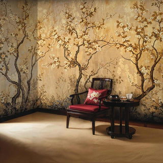Flowering branch Wall Mural in gold and brown tones displayed in reading nook with red velvet chair