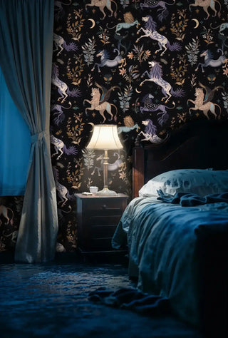 Folklore wallpaper displaying mystical creatures and moon motifs, featured in moody bedroom with blue bedding and curtains