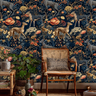 Forest creatures wallpaper featuring graceful deer and blooms, displayed in cozy reading nook with rattan chair
