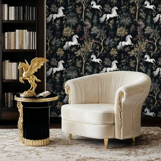 Forest horse wallpaper featuring white steeds and botanical trees, displayed in luxurious study with cream armchair