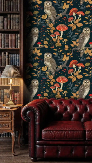 Forest owl wallpaper with red mushrooms and autumn leaves in deep teal, displayed in a classic study with leather sofa