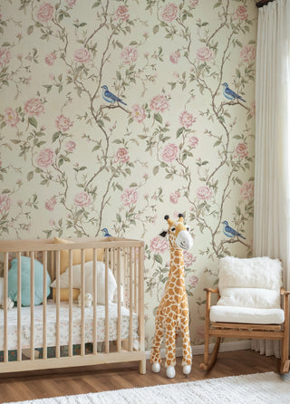 Garden bird wallpaper featuring roses and branches, cream base, displayed in serene nursery with wooden crib
