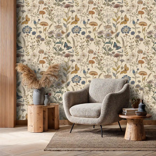 Garden botanical wallpaper with wildflowers and blue butterflies, featured in modern living room with grey armchair