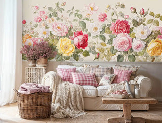 Garden rose wall mural featuring colorful blooms and green foliage, displayed in cozy living room with wicker basket