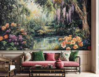 Garden sanctuary wall mural showing lush florals and forest stream in modern living room with pink velvet sofa